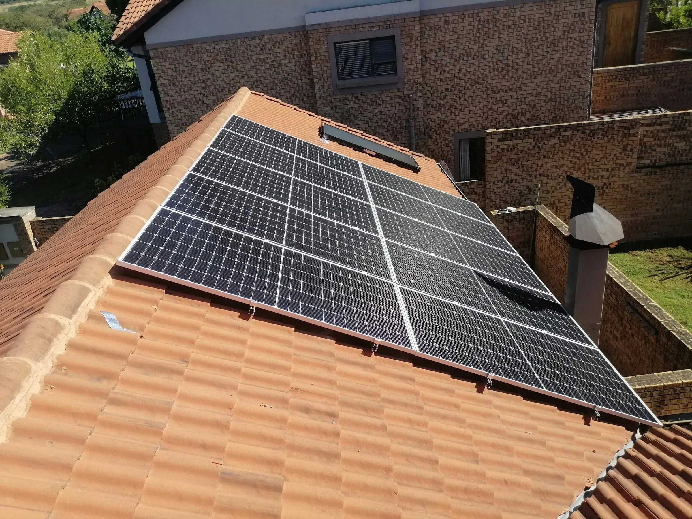 Solar panels installed on a clay tile roof